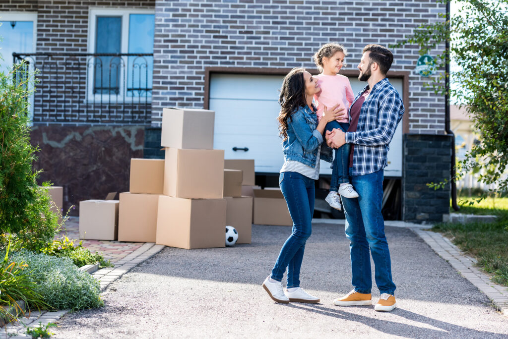 Family in front of new house